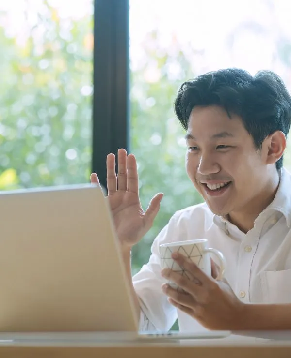 man smiling during video call